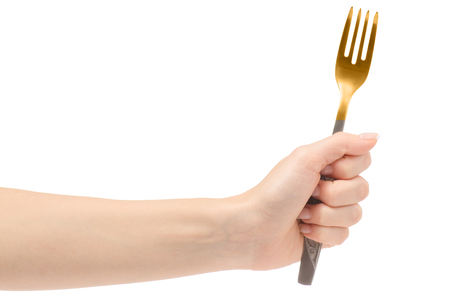 Female hand fork on white background isolationの写真素材