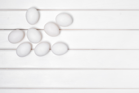 Eggs white on a white wooden backgroundの写真素材
