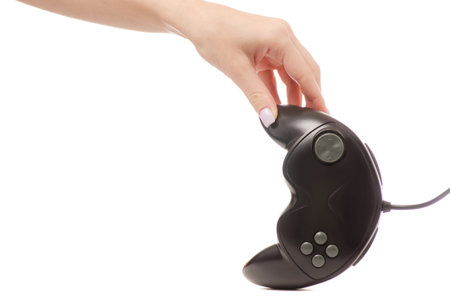 gamepad black in hand on white background isolation