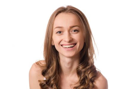 Beautiful young woman emotion laughing smile fun on white background isolationの写真素材