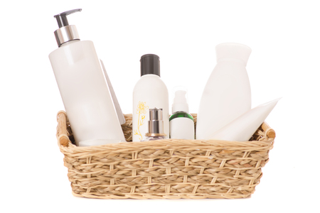 A straw basket with makeup on white background isolationの写真素材