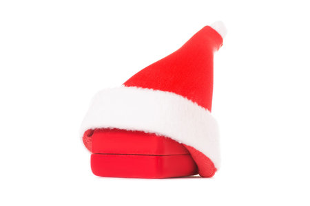 Female hand holding a box for new year jewelry red on a white background