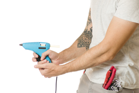 Man in a pocket constructing tools on a white background isolationの写真素材