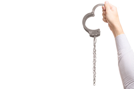 Male hand cuffs isolated on white background isolationの写真素材
