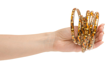 Female hand holding a light-emitting diode tape on a white background isolationの写真素材