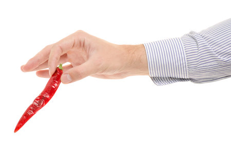 Man's hand with a red pepper on white background isolation