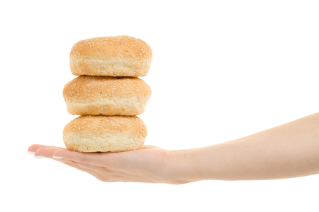 Female hand buns for hamburgers on a white background isolationの写真素材
