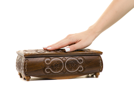 Female hand casket on white background isolationの写真素材