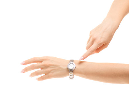Clock on hand female hands isolated on white background isolationの写真素材