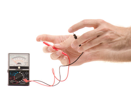 Multimeter analog in male hands isolated on white background isolation
