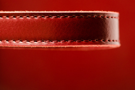 Leather woman's red bag macro beauty blurred backgroundの写真素材