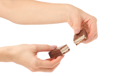 Chocolate cake candy biscuit milk in hand on a white background isolationの写真素材