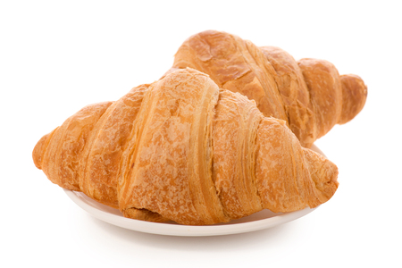 Croissants on a white plate isolated on white background isolationの写真素材