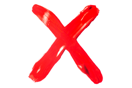 Cross red paint on white background isolationの写真素材