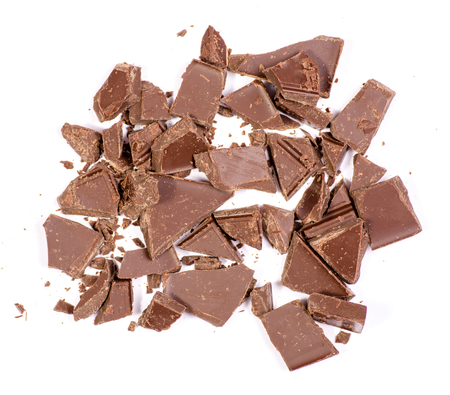 Pile chopped, milled chocolate shavings isolated on white, top viewの写真素材