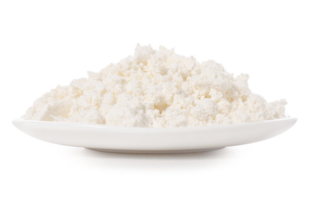 Plate of cottage cheese isolated on white background isolationの写真素材