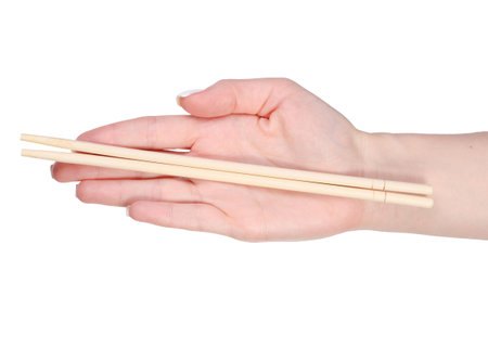 Sticks for sushi in hand on white background isolation, top viewの写真素材