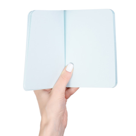 Notepad diary in hands on white background isolation, top viewの写真素材