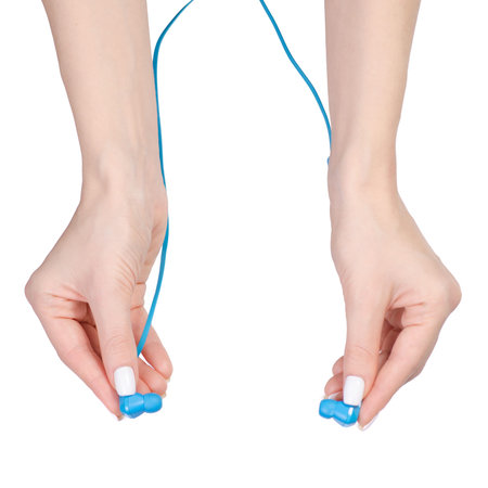 Blue headphones in hands on a white background isolation, top view