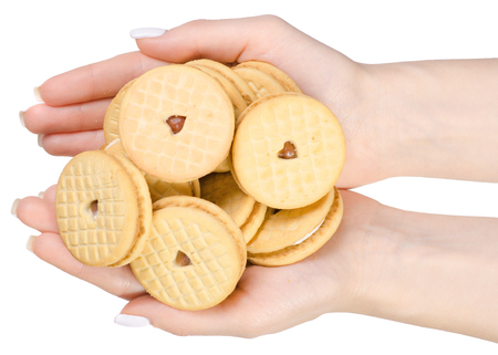 Biscuits with strawberry cream in hand on a white background isolation, top viewの写真素材