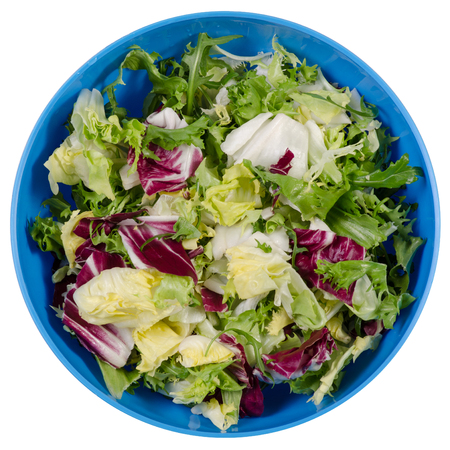 Mix of lettuce leaves in a bowl on a white background isolation, top viewの写真素材