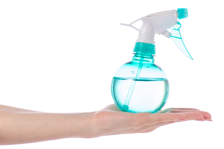 Pulverizer for plants in hand on a white background isolationの写真素材