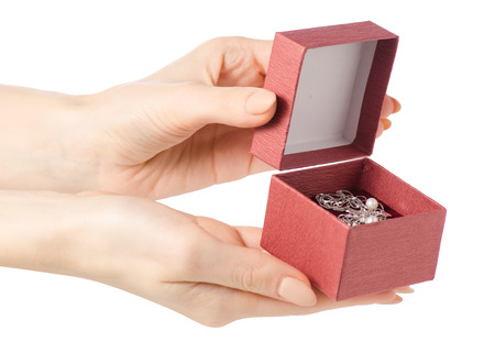 Silver female bracelet in a hand box jewerly on a white background isolationの写真素材