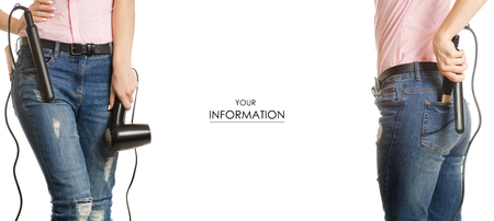 Woman in jeans stylist hairdresser in hands of hair dryer curling hair pattern on white background isolationの写真素材