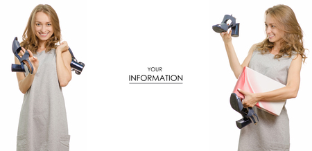 Young woman with shoes sandals in hands beauty sale buy shop set pattern on a white background isolationの写真素材