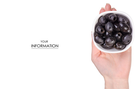 Olives black in bowl in hand pattern on a white background isolationの写真素材