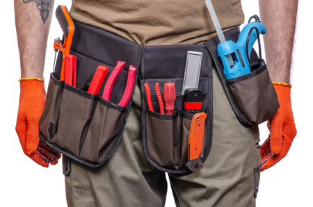 Construction belt on a man tool belt builder on a white background isolationの写真素材