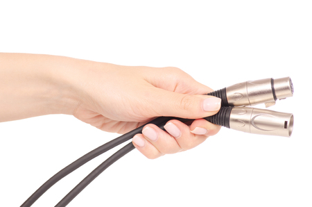 Xlr cable in hand sound microphone electronic on white background isolationの写真素材