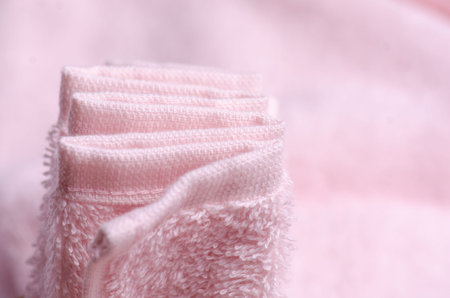Pink towel macro fabric material soft bath blur backgroundの写真素材
