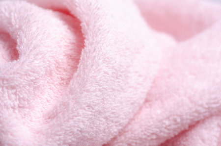 Pink towel macro fabric material soft bath blur backgroundの写真素材