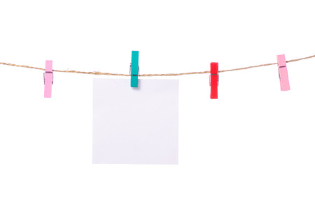 Sheet for notes clothespins rope on white background isolationの写真素材