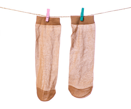 Kapron socks clothespins rope on a white background isolationの写真素材
