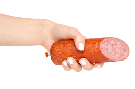 A smoked sausage in hand on a white background isolationの写真素材