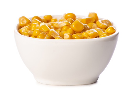 Canned corn in a bowl on a white background isolationの写真素材