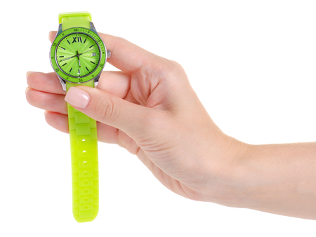 Green clock on a hand on a white background isolationの写真素材