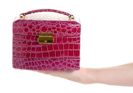 Leather casket jewerly in hand on white background isolationの写真素材