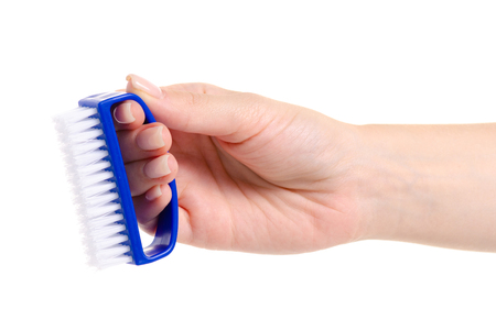 Kitchen brush in hand clean on white background isolationの写真素材
