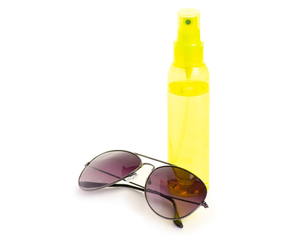 Bottle spray for suntan sun glasses on white background isolationの写真素材