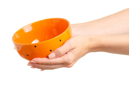 Soup plate in hand on white background isolationの写真素材