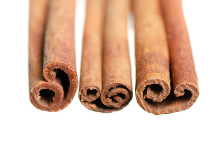 Cinnamon sticks close-up macro on white background isolationの写真素材