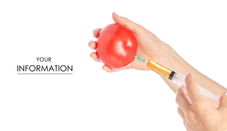 Syringe in the hands of tomato pattern on a white background isolationの写真素材