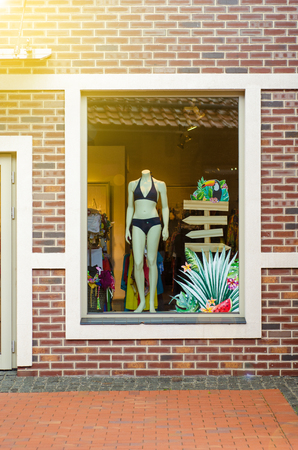 Showcase of shop swimwear in the road streetの写真素材