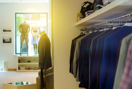 Rack with hangers man male clothes mannequin shop fashionの写真素材