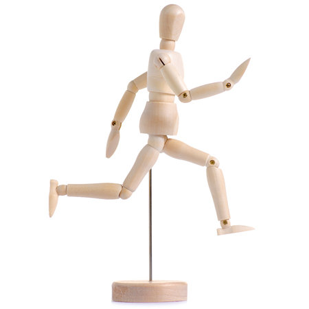 Wooden figure of a man run on a white background isolationの写真素材