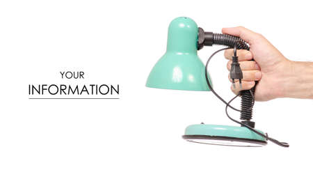 Old desk lamp in hand pattern on white background isolationの写真素材