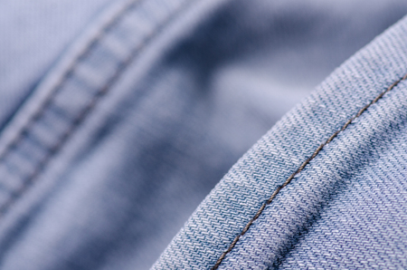 Blue gray jeans fabric macro texture fashion on blur backgroundの写真素材